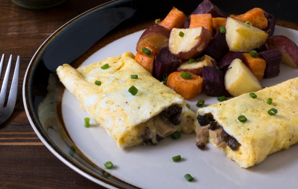Chicken neck meat, morel, and cheddar cheese omelet with duck fat roasted mixed potatoes hr-9846