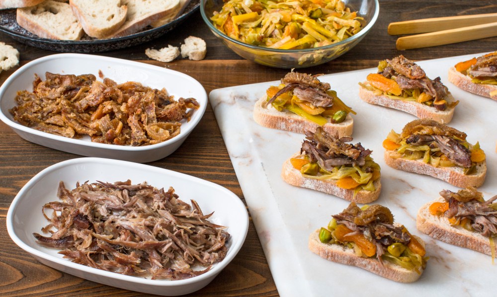 Duck neck meat canapes with berbere spiced caramelized leeks, dried apricots, and pistachios hr-9769